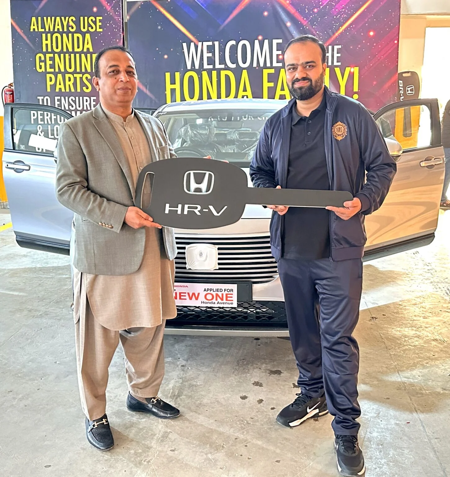 Mr.-Zeeshan-Khan-receiving-New-Honda-HR-V-from-CEO-Rays-Marketing-Mr.-Naveed-Chaudhry